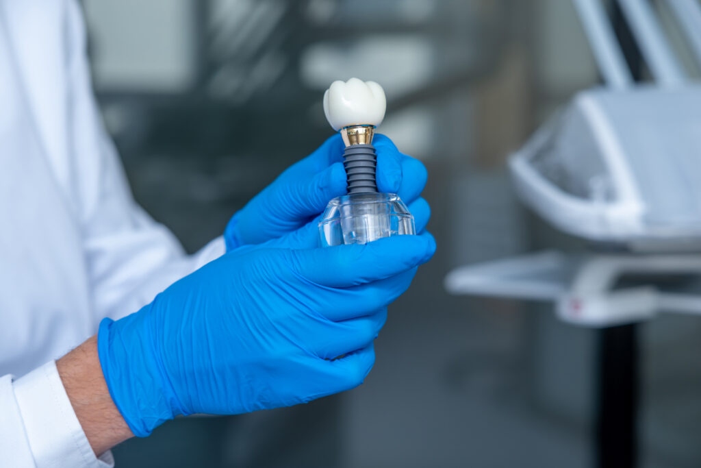 Dentist presenting porcelain veneers and dental crowns in Clapham
