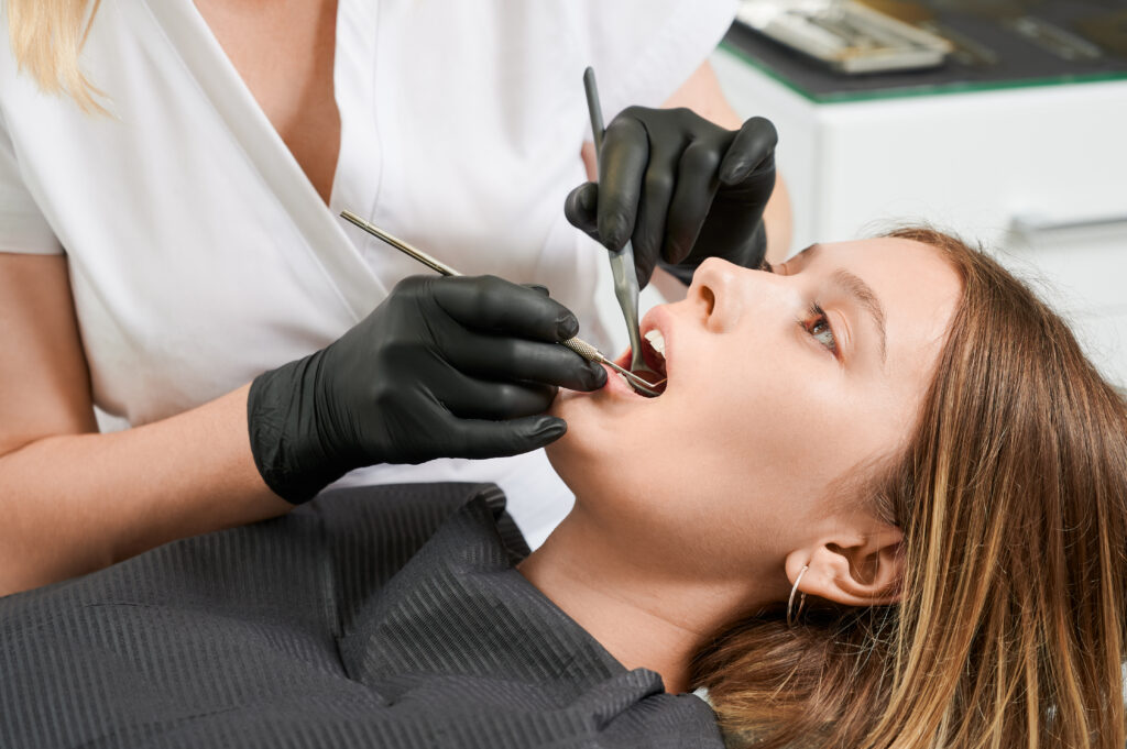 Dentist carrying out a private dental check-up in Clapham
