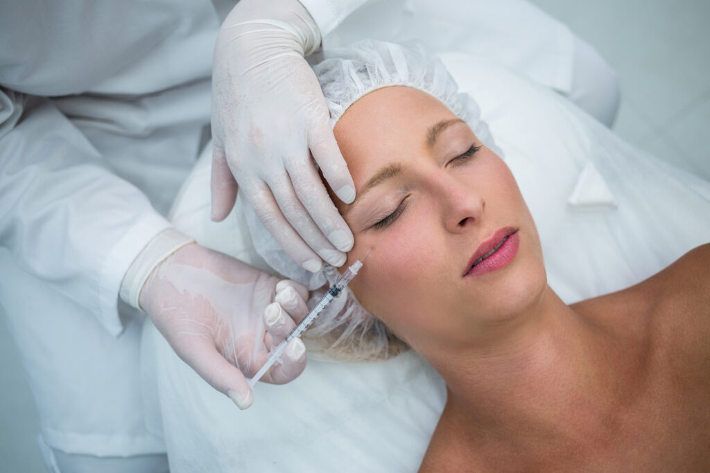 Doctor performing an aesthetic medicine treatment in Clapham